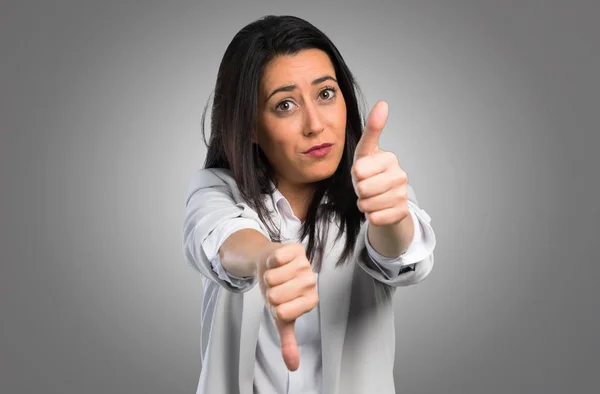 Pretty Woman Making Good Bad Sign Grey Background — Stock Photo, Image