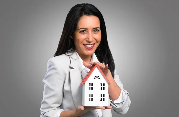 Pretty Woman Holding Little House Grey Background — Stock Photo, Image
