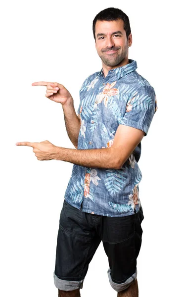 Handsome Man Flower Shirt Pointing Lateral Isolated White Background — Stock Photo, Image