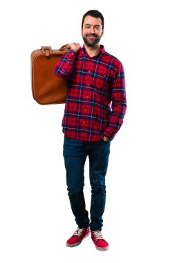 Yakışıklı adam tutarak bir vintage çanta