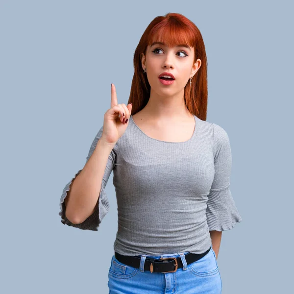 Young Redhead Girl Standing Thinking Idea Blue Background — Stock Photo, Image