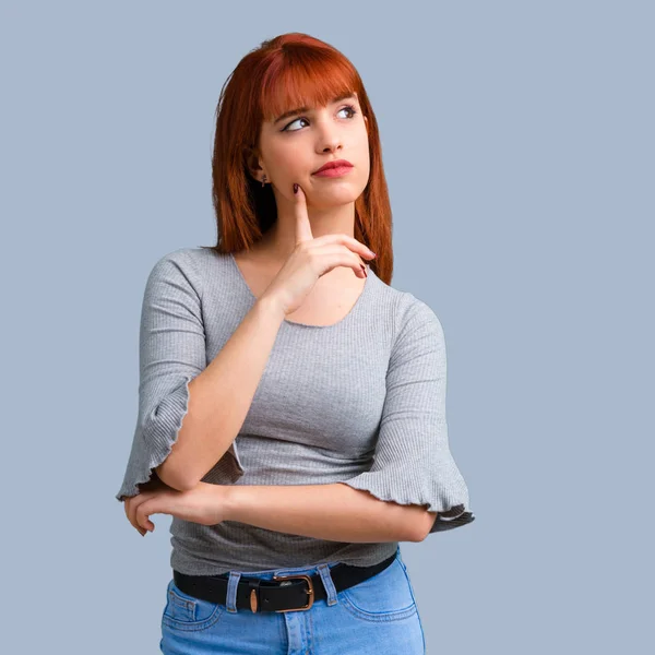 Young Redhead Girl Having Doubts Confuse Face Expression Blue Background — Stock Photo, Image