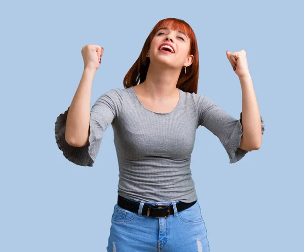 Young Redhead Girl Celebrating Victory Blue Background — Stock Photo, Image