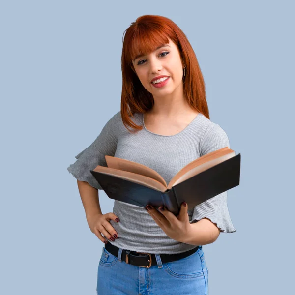 Young Redhead Girl Holding Reading Book Blue Background — Stock Photo, Image