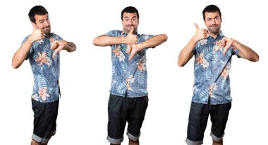 İyi-kötü işaret yapma çiçek forması ile yakışıklı adam kümesi