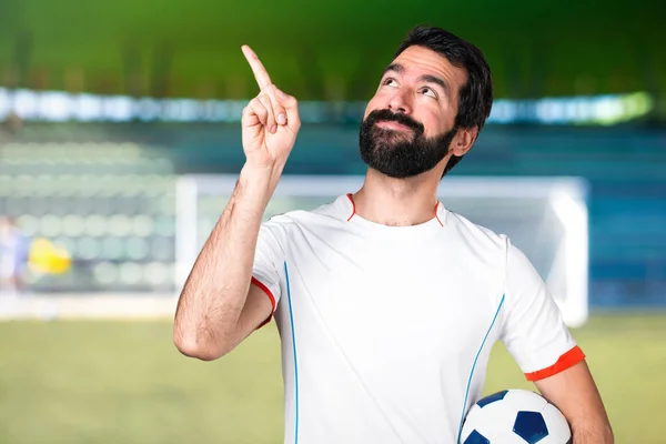 Football Player Holding Soccer Ball Pointing Football Pitch — Stock Photo, Image