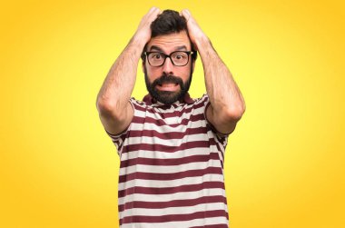 Frustrated man with glasses on colorful background clipart