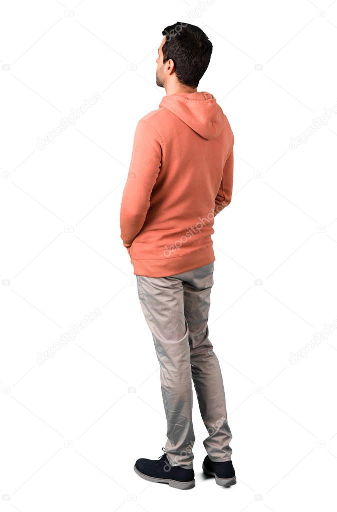Full body of Man in a pink sweatshirt looking back on isolated white background. Ideal for use in architectural designs