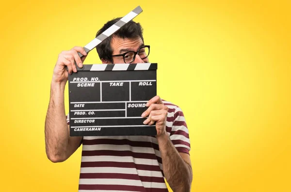 Man Glasses Holding Clapperboard Colorful Background — Stock Photo, Image