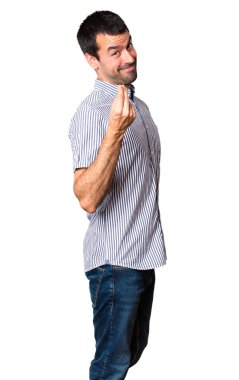 Yakışıklı adam para jest yapma beyaz arka plan izole