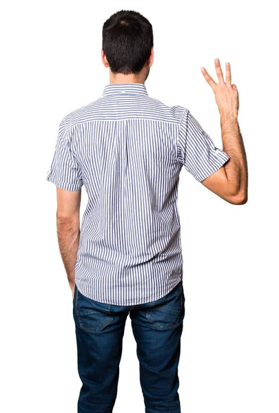 Yakışıklı adam üç izole beyaz zemin üzerine sayma