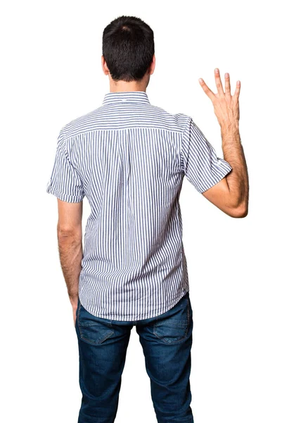 Yakışıklı adam dört izole beyaz zemin üzerine sayma