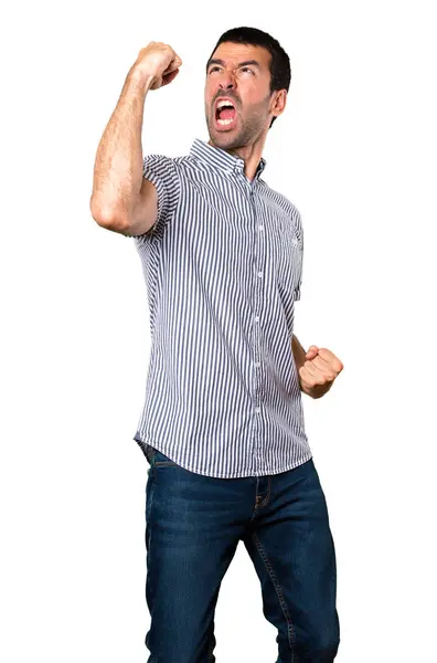 İzole beyaz arka plan üzerinde şanslı yakışıklı adam