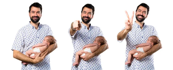 Jovem Pai Com Seu Bebê Recém Nascido Apontando Para Frente — Fotografia de Stock
