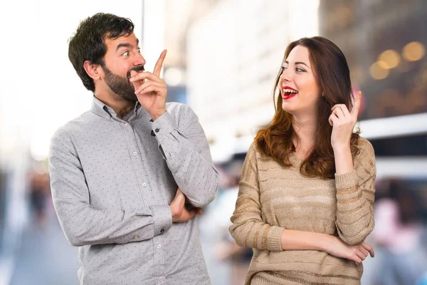 Young couple thinking on unfocused background