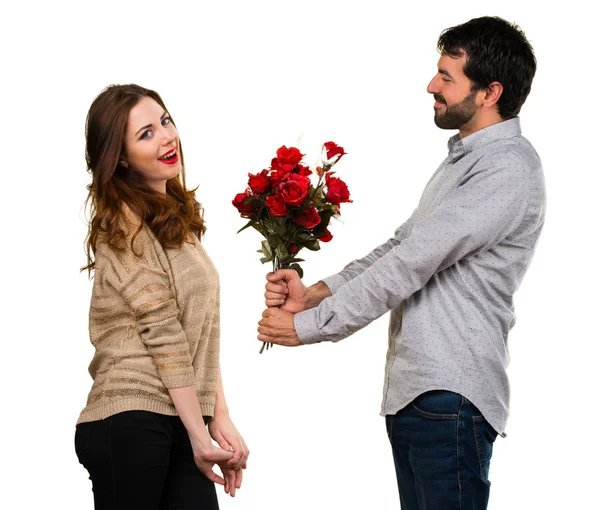 Man giving flowers to a girl