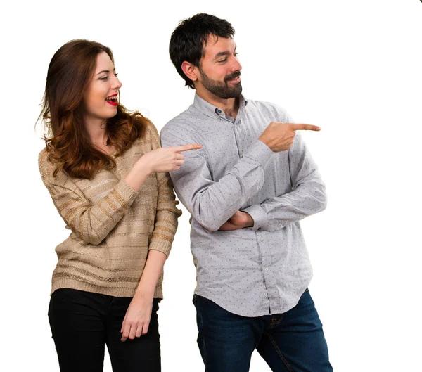 Young Couple Pointing Lateral — Stock Photo, Image