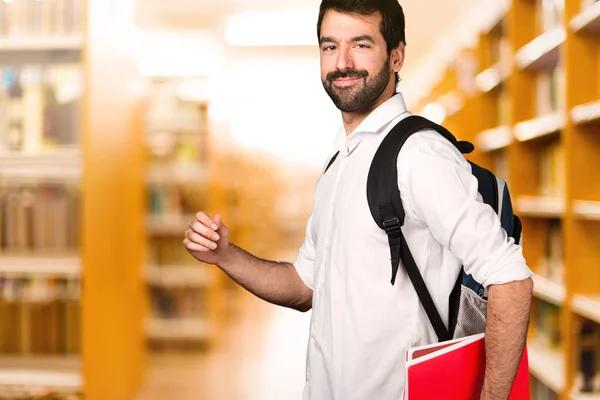 Student Läuft Auf Defokussierter Bibliothek — Stockfoto