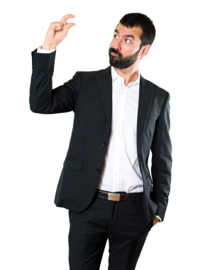 Yakışıklı işadamı küçük işareti yapmak