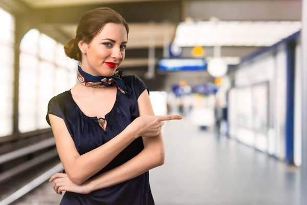 Pretty Stewardess Pointing Lateral Airport — Stock Photo, Image