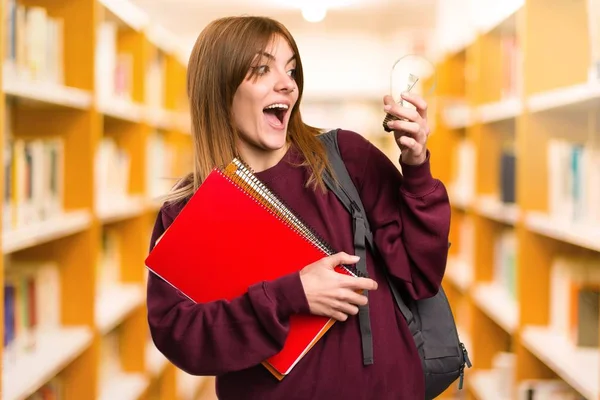 Student Woman Holding Bulb Unfocused Background — Stock Photo, Image