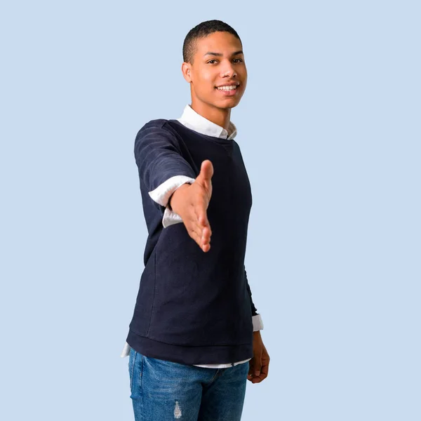 Young African American Man Handshaking Good Deal Isolated Blue Background — Stock Photo, Image