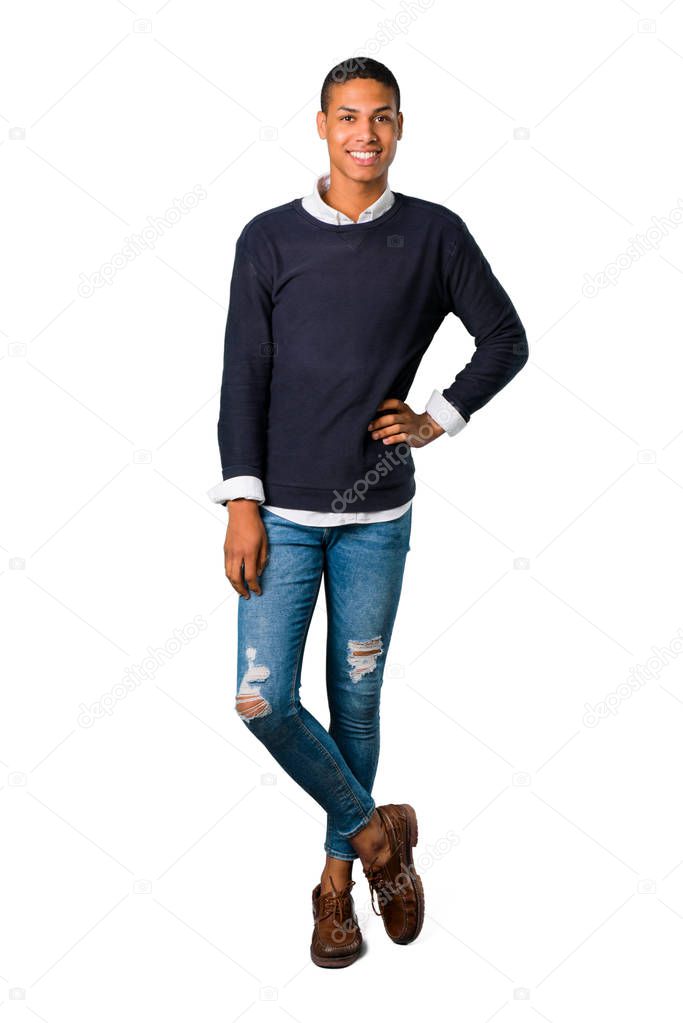 Young african american man posing with arms at hip and laughing looking to the front on isolated white background. Ideal for use in architectural designs