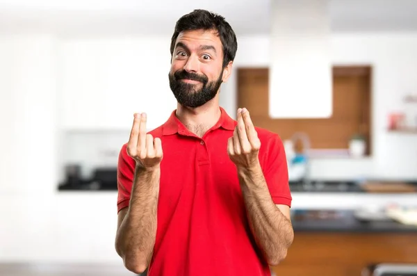 Hombre Guapo Haciendo Gesto Dinero Dentro Casa —  Fotos de Stock