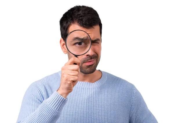 Man Blue Sweater Holding Magnifying Glass — Stock Photo, Image