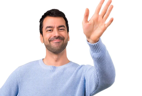 Człowiek Niebieski Sweter Pozdrawiając Ręką — Zdjęcie stockowe