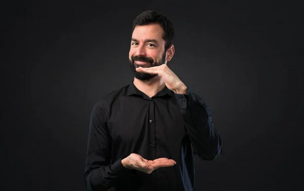 Handsome Man Beard Holding Something Black Background — Stock Photo, Image