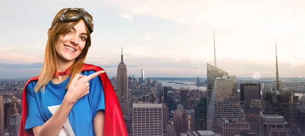 Pretty Superhero Girl Pointing Lateral Skyscraper City — Stock Photo, Image