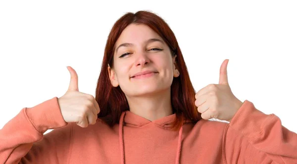 Young Redhead Girl Pink Sweatshirt Giving Thumbs Gesture Smiling Because — Stock Photo, Image