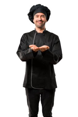 Boşaltmak hayali avuç içinde tutarak siyah üniformalı Şef erkeklere izole beyaz zemin üzerinde bir reklam eklemek için