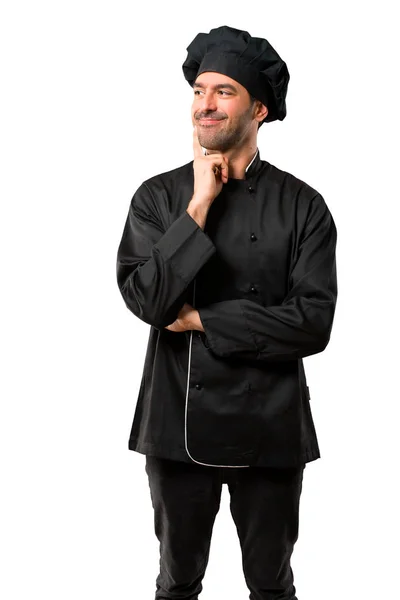 Chef Hombre Uniforme Negro Pie Pensando Una Idea Mientras Mira — Foto de Stock