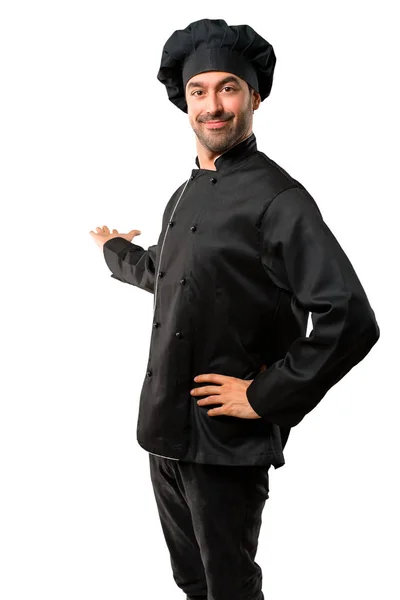Chef Man Black Uniform Pointing Back Index Finger Presenting Product — Stock Photo, Image