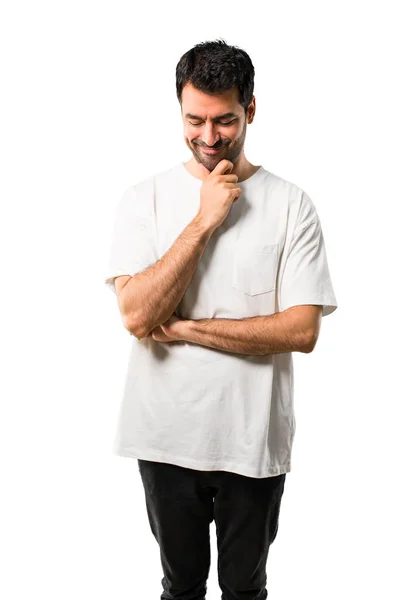 Молодой Человек Белой Рубашке Стоит Смотрит Вниз Рукой Подбородок Изолированном — стоковое фото