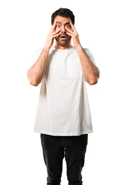 Young Man White Shirt Surprised Covering Face Hands While Looking — Stock Photo, Image