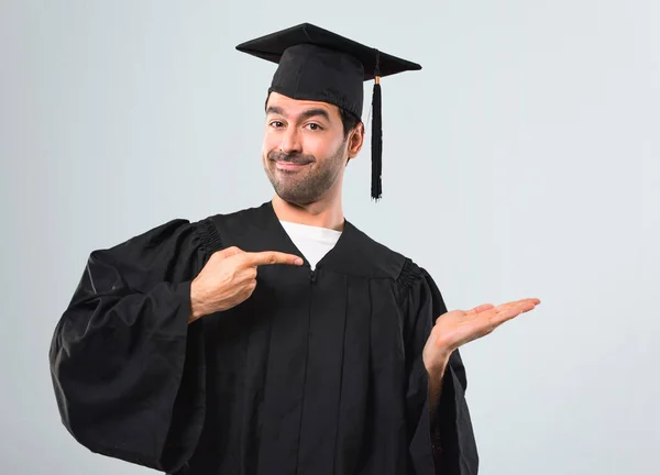 Man His Graduation Day University Holding Copyspace Imaginary Palm Insert — Stock Photo, Image
