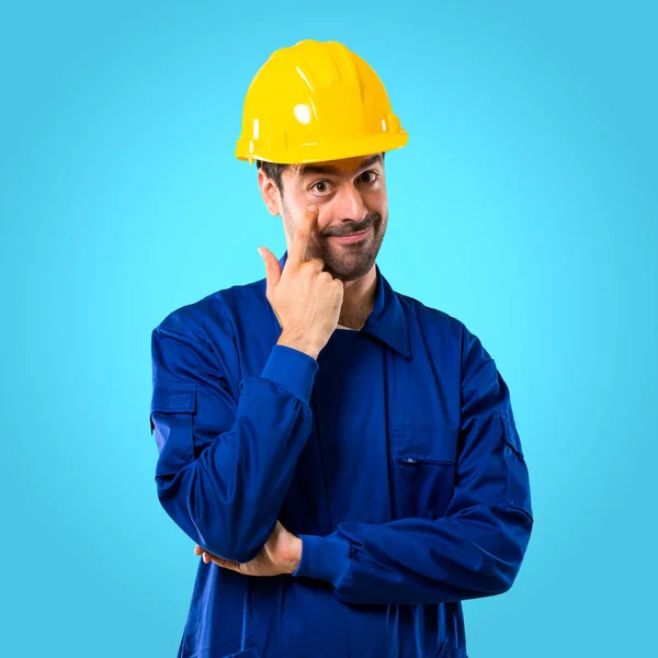 Young Workman Helmet Standing Looking Front Opening Eye Finger Blue — Stock Photo, Image