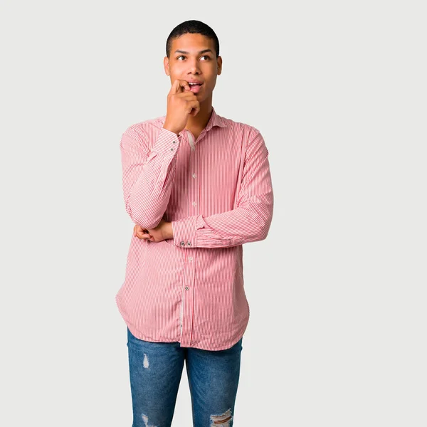 Young African American Man Having Doubts Confuse Face Expression While — Stock Photo, Image