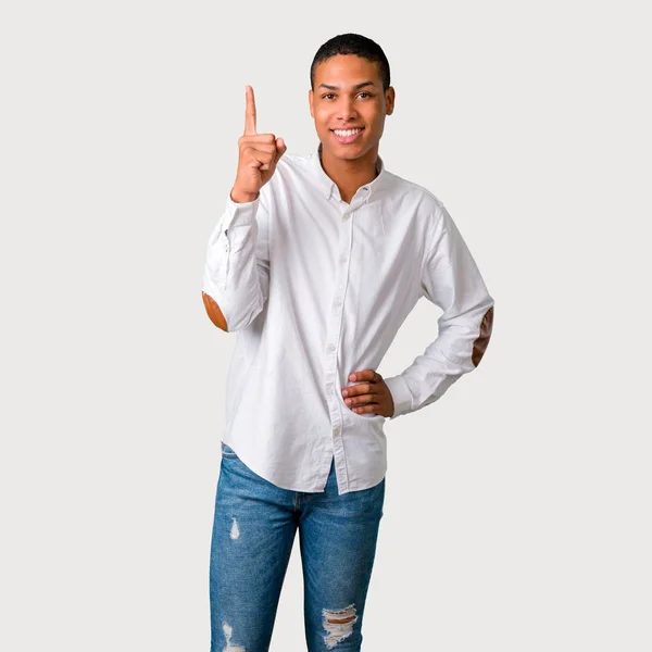 Jovem Afro Americano Mostrando Levantando Dedo Sinal Melhor Fundo Cinza — Fotografia de Stock