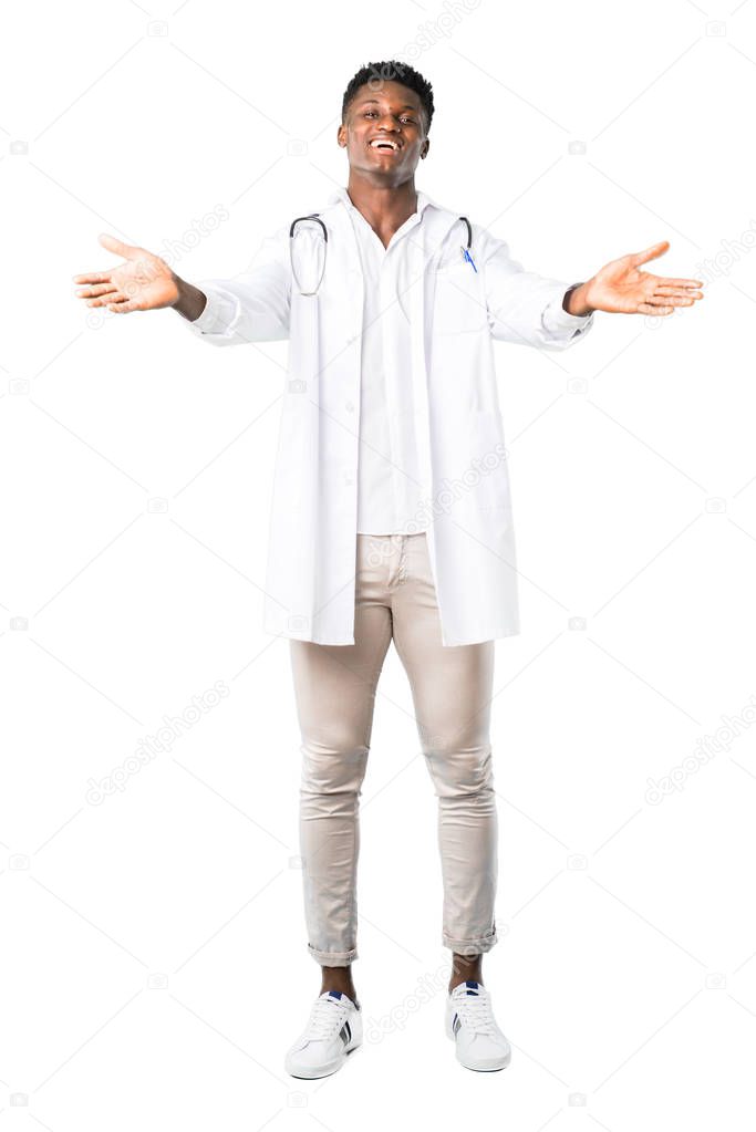 Full body of African american doctor presenting and inviting to come with hand. Happy that you came on white background