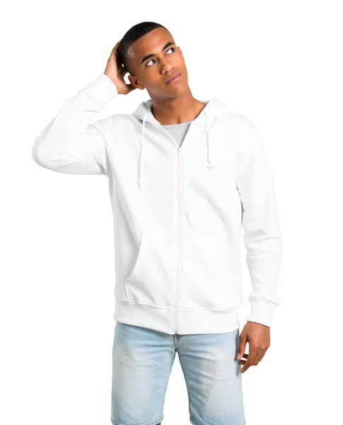 Dark Skinned Young Man White Sweatshirt Standing Thinking Idea While — Stock Photo, Image