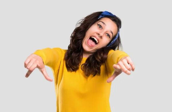 Young Girl Yellow Sweater Blue Bandana Her Head Pointing Finger — Stock Photo, Image