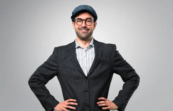 Handsome Modern Man Beret Glasses Posing Arms Hip Grey Background — Stock Photo, Image