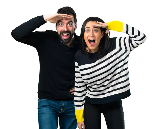 Couple Showing Something White Background — Stock Photo, Image