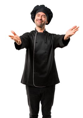 Şef sunulması ve el ile gelmek davet siyah üniformalı erkeklere. Mutlu izole beyaz arka plan üzerinde geldi