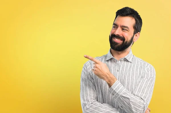 Handsome Man Beard Pointing Finger Side Presenting Product — Stock Photo, Image