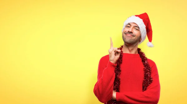 Man Red Clothes Celebrating Christmas Holidays Showing Lifting Finger Sign — Stock Photo, Image